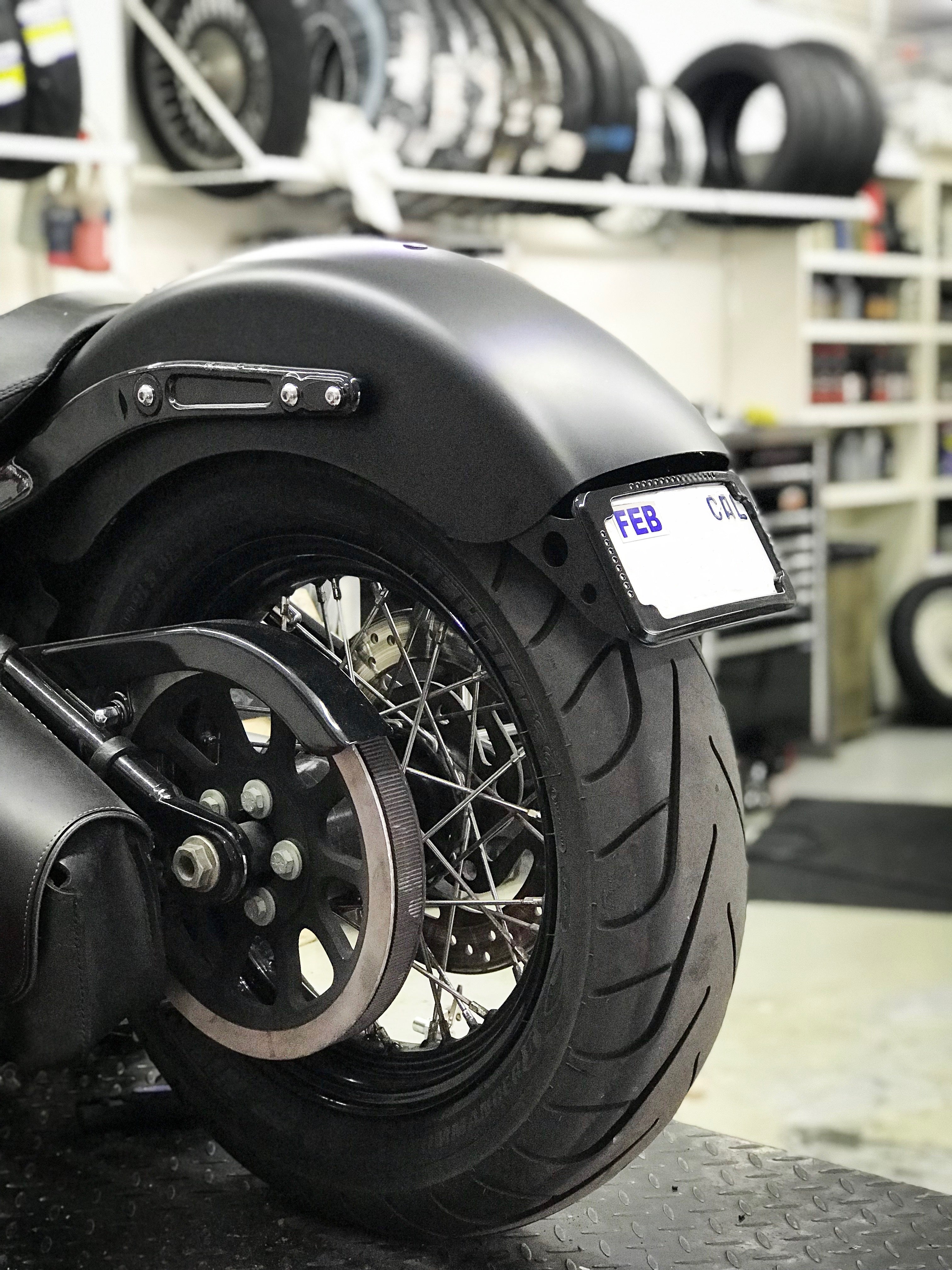 Curved License Plate Relocation For Softails